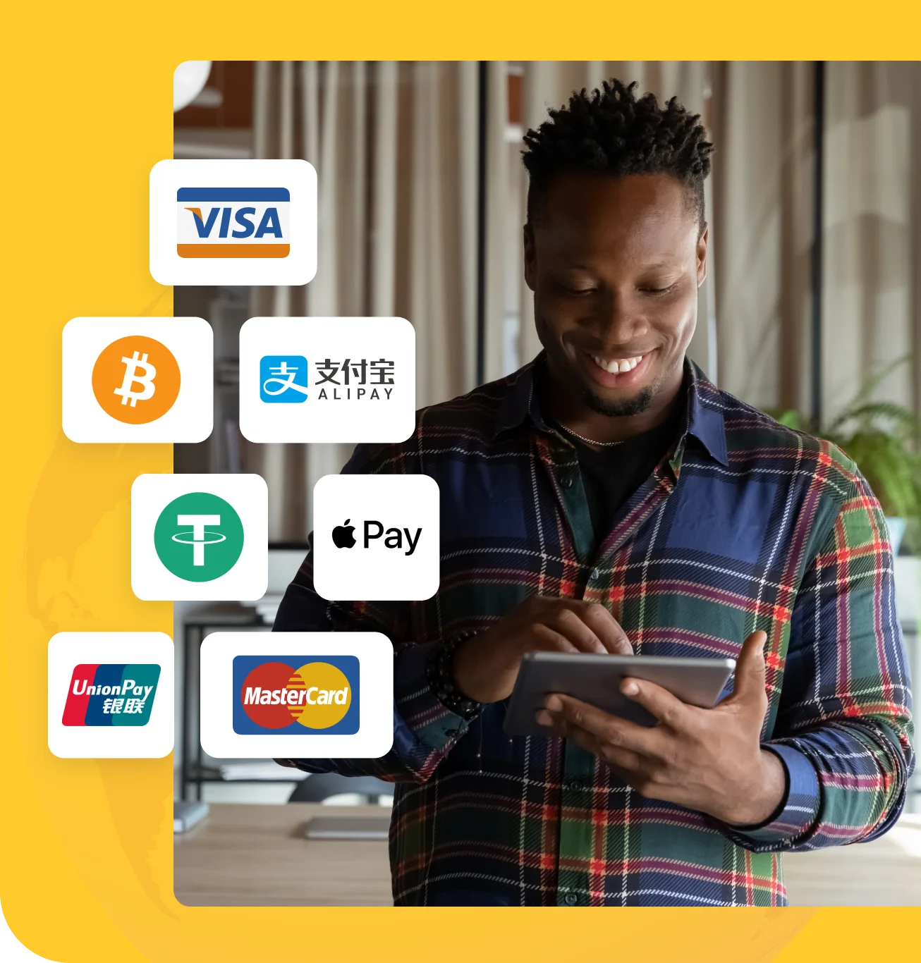 young man smiling while using his tablet with payment brand logos shown such as visa, paypal, alipay, apple pay, and union pay